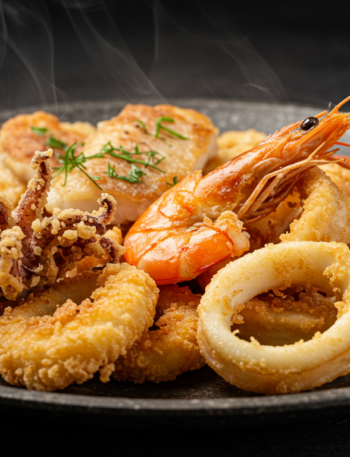 "Plate of Moroccan-style crispy fried fish with a side of couscous."