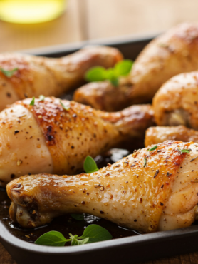 Crispy oven-baked chicken drumsticks on a cooling rack