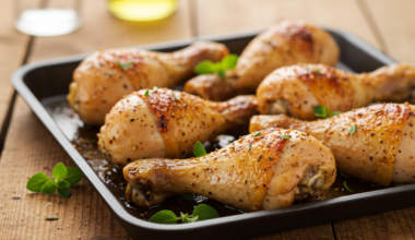 Crispy oven-baked chicken drumsticks on a cooling rack
